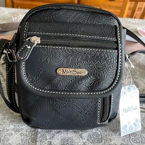 Blk ladies small purse 9 inches long, 6 inches wide 3 zipper and 1 Velcro close